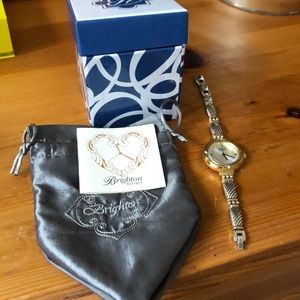 Never worn. Was a gift. Still have box and pouch.